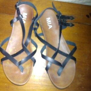 Well loved pre-owned leather black and tan Mia sandals
